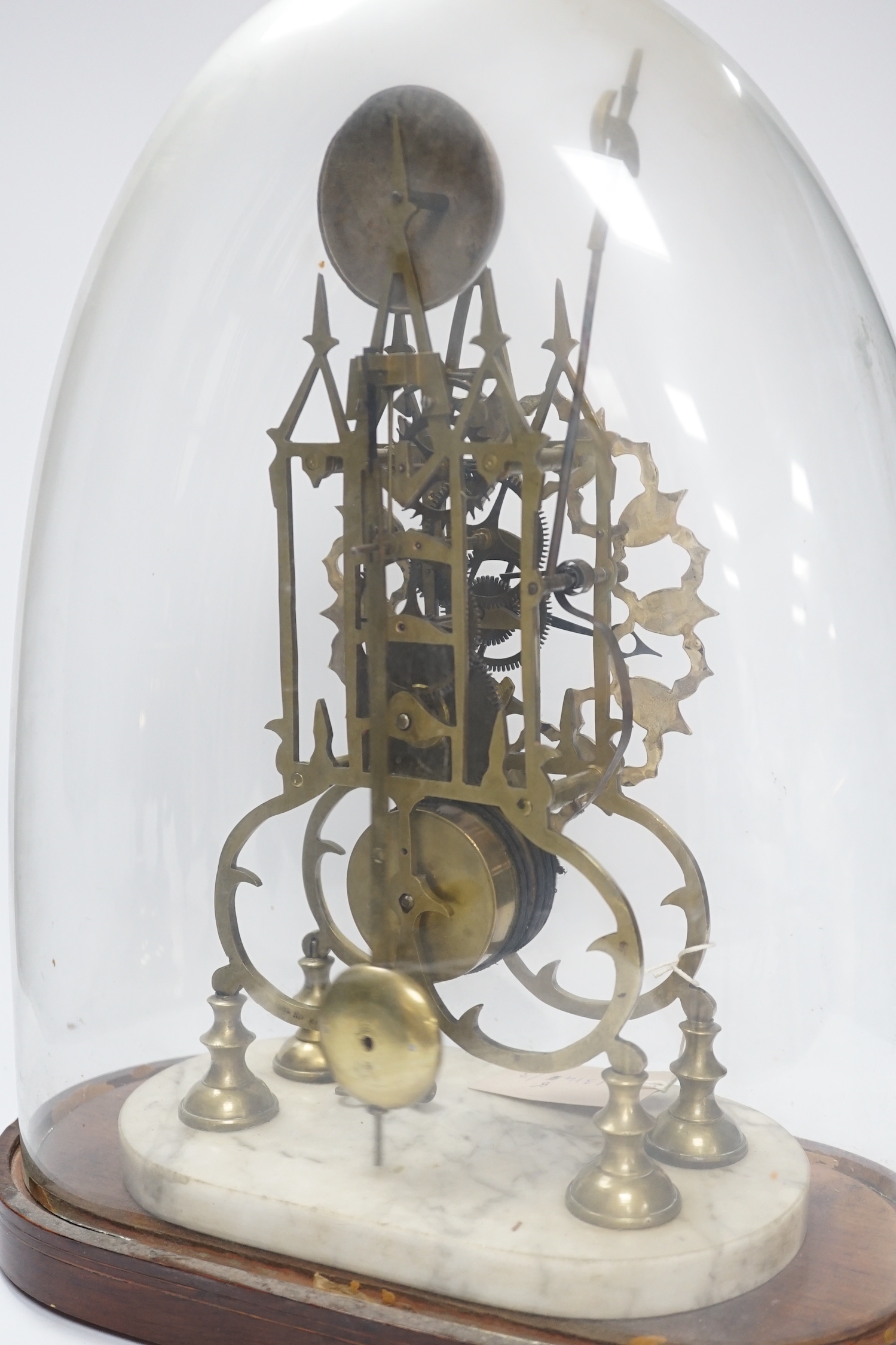 A late 19th century skeleton clock, under glass dome, 44cm high